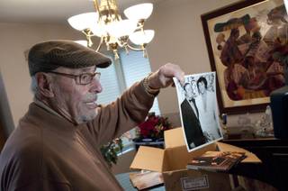 Long-time Las Vegas resident, Emilio Muscelli, shows off a photograph of him posing with Elvis Presley, Monday Jan. 9, 2012. Emilio worked as Vegas' most beloved maitre'd of the Hilton, and the International before that, and befriended many important people in the 